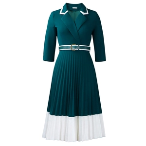 Detail view of dark teal pleated dress with V-neck, contrast trim and belted waist