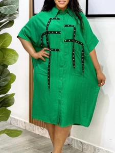 Short sleeve bright green shirt dress with lapel collar and black eyelet decorative tape