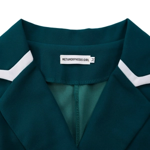 Detail of dark green blazer collar with white contrast piping and branded size label