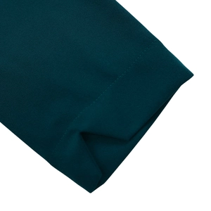 Detailed stitching and fabric texture on dark green long sleeve A-line dress