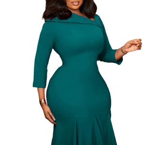 Detail of emerald green bodycon dress featuring asymmetric collar and pleated fishtail hem