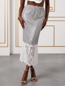High-waisted silver sequin skirt with white lace hem, stylish slim fit party wear