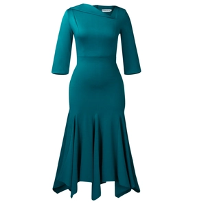 Detail of the elegant asymmetrical neckline and fitted bodice on a dark green dress