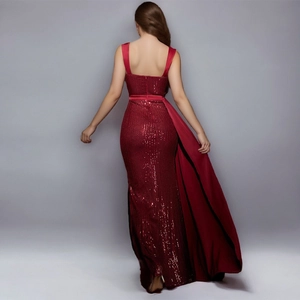 Sparkling wine red sequin evening gown with a high waist and elegant long train detail