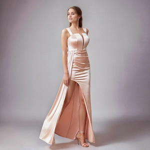 Elegant champagne satin evening gown with a deep V-neck, high slit, and glossy silk texture