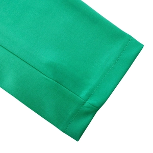 Detailed close-up of green long sleeve dress cuffs with high-quality stitching and fabric