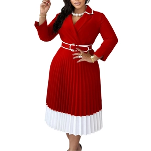 Detail of red business dress with pleated skirt, white belt, and classic lapel collar