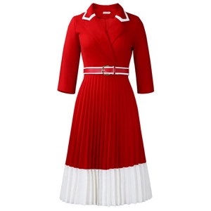 Detailed view of the red pleated A-line dress with white collar and a golden buckle belt