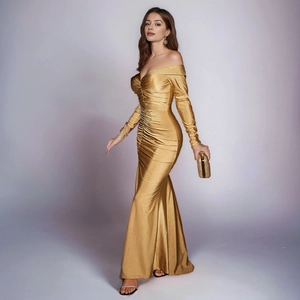 Close-up detail of luxury gold metallic mermaid dress with elegant ruched off-shoulder neck