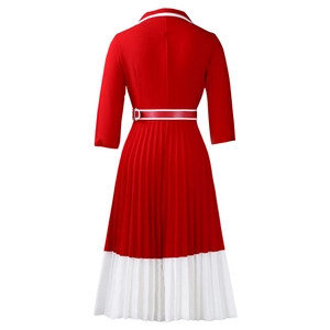 Detail view of the back of a red and white pleated A-line dress with long sleeves