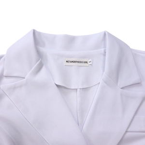 Detail of white blazer collar with notch lapels and Metamorphosis Girl brand label in size S