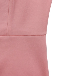 Macro shot of precise stitching on high-quality pink knit fabric for elegant dresses