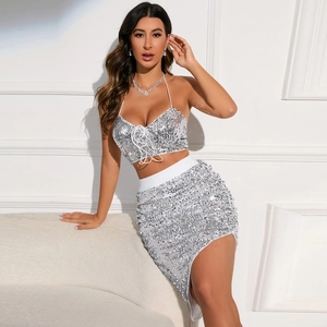 Sparkly white sequin two-piece set featuring halter neck tie-up crop top and mini skirt