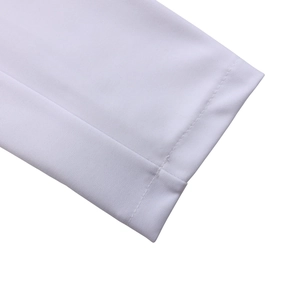 Close-up of white blazer dress showing refined sleeve cuffs and breathable mesh texture