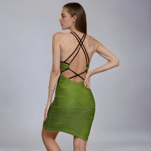 Elegant green bodycon bandage dress with open back and crisscross black straps detail