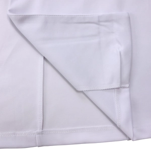 Macro shot of stitching details on white long sleeve double-breasted dress hemline