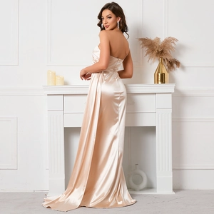 Elegant champagne satin evening gown featuring a floor-length mermaid silhouette and drapes