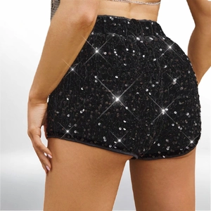 Sparkly black sequin high-waisted shorts for party wear on a fashion model