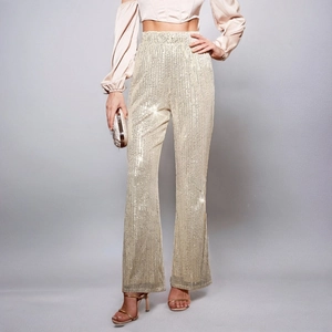 Pantaloni a zampa con paillettes oro champagne a vita alta per feste ed eventi eleganti