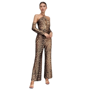 Chic leopard print halter neck jumpsuit with matching sleeves and wide leg trousers