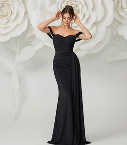 Detail of black strapless evening dress with textured fabric and elegant side drape