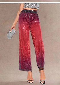 Close-up of red and purple gradient sequin wide-leg pants with elastic waist detail