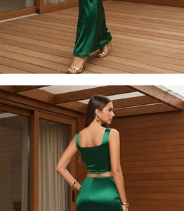 Detailed back view of dark green satin two-piece set with cropped top and long skirt