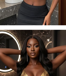 Detailed view of model wearing gold V-neck camisole with long wavy black hair styling