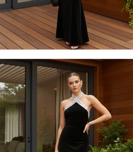 Detail of cross halter neck with silver sequins on black velvet evening fish tail dress