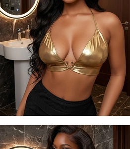 Detail of metallic gold halter top showing V-neck design and reflective texture
