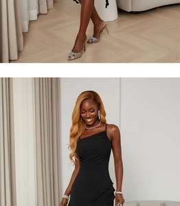 Detail of ruffled hem on a black one-shoulder party dress with silver rhinestone sandals
