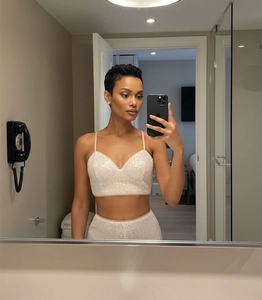 Detailed close-up of champagne sequin crop top featuring a deep V-neck and thin straps