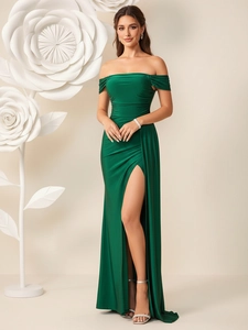 Elegant emerald green off-shoulder evening gown with satin finish and high side slit