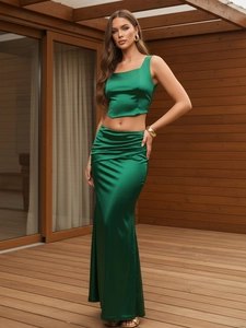 Dark green satin two-piece set with cropped tank top and pleated high waist slit maxi skirt