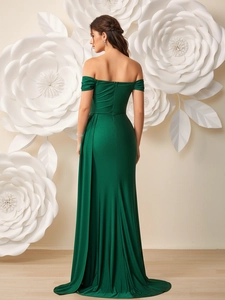 Elegant emerald off-shoulder evening dress with high slit and backless draped design