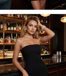 Détail d'un ensemble de bijoux en perles avec collier et bracelet sur une robe cocktail noire