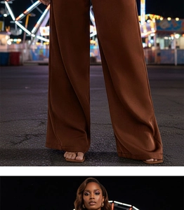 Détail du pantalon marron à taille haute et jambes larges avec un élégant drapé fluide