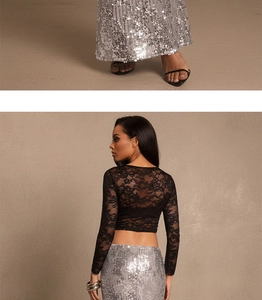 Detail of shimmering silver sequin skirt with high waist and elegant slit for evening parties