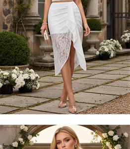 Detailed view of white floral lace irregular skirt hem with elegant ruffles and textures