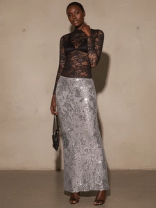 Elegant high-waisted silver sequin maxi skirt with back slit for party wear style