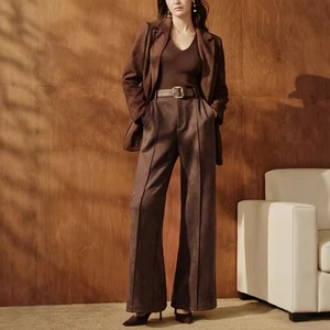 Deep brown high waist wide leg suede pants with a formal blazer and pointed shoes