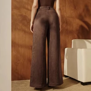 Detailed back view of high waist suede wide-leg trousers showing smooth drape and texture