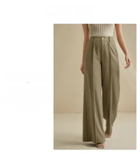 Detail view of high-waist wide-leg olive green trousers with double front pleats