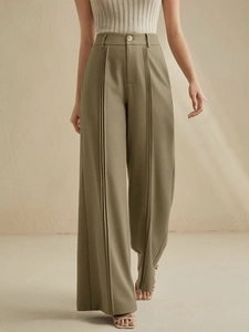 Elegant olive green high waisted wide leg trousers for women with front pleats and draped fit