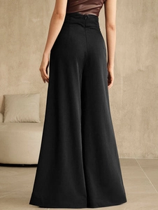 Women high-waist wide-leg trousers in black drape fabric, rear view showing zipper detail