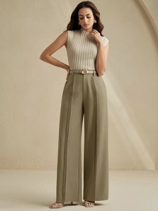 Women's high waist wide leg trousers in olive green paired with beige sleeveless knit top