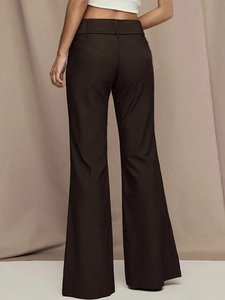 Deep brown high-waisted flared trousers with elegant drape shown from the back view
