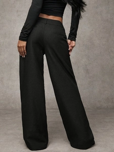 Women's wide leg black trousers featuring high waist design and elegant draped suit fabric