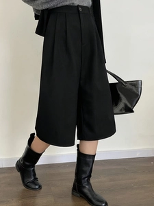 Women's high waist black wide-leg culottes with pleats for a casual minimalist office look