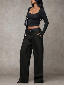 Women black low waist wide leg trousers and crop top set with a minimalist belt